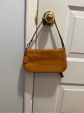 Coach Hampton Demi Pouch shoulder bag in a saddle brown leather